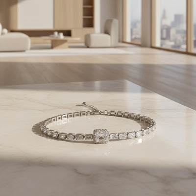 Silver bracelet with a red gemstone on a red textured background